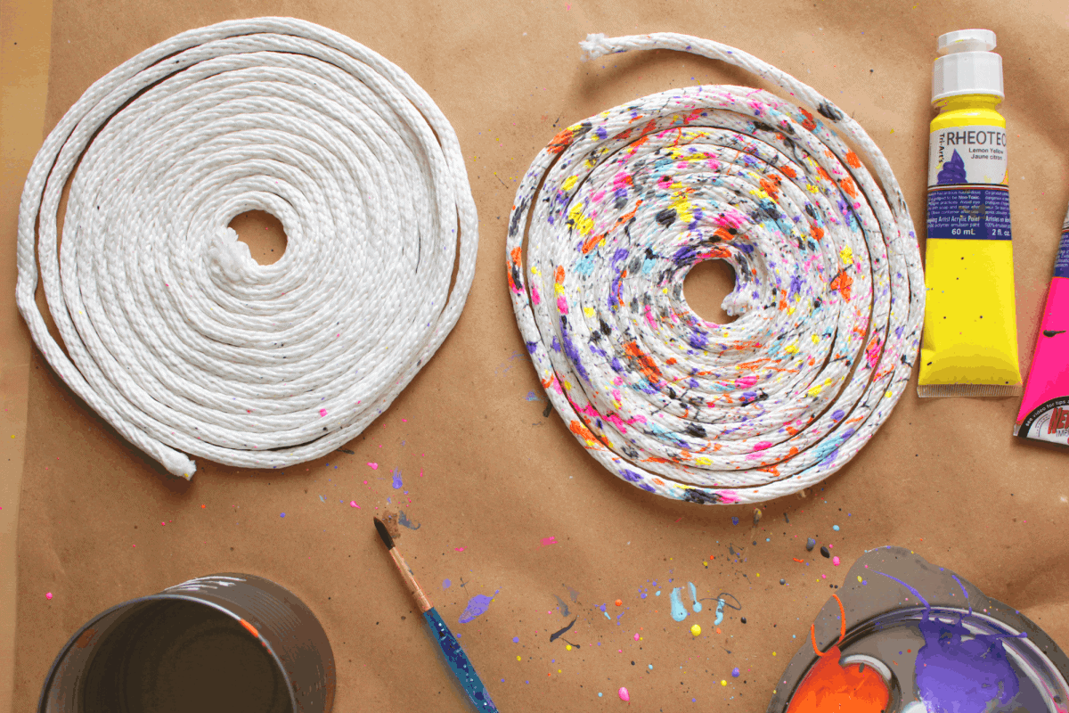Using acrylic paint and leftover rope, DIY these beautiful and easy trivets. Or make placemats, coasters or storage bins using this method!