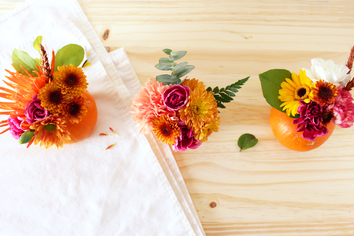 DIY mini pumpkin florals come in handy whether you're a guest or a hostess. You can bring these to a party as a hostess gift and if you're the host, create a beautiful table setting!