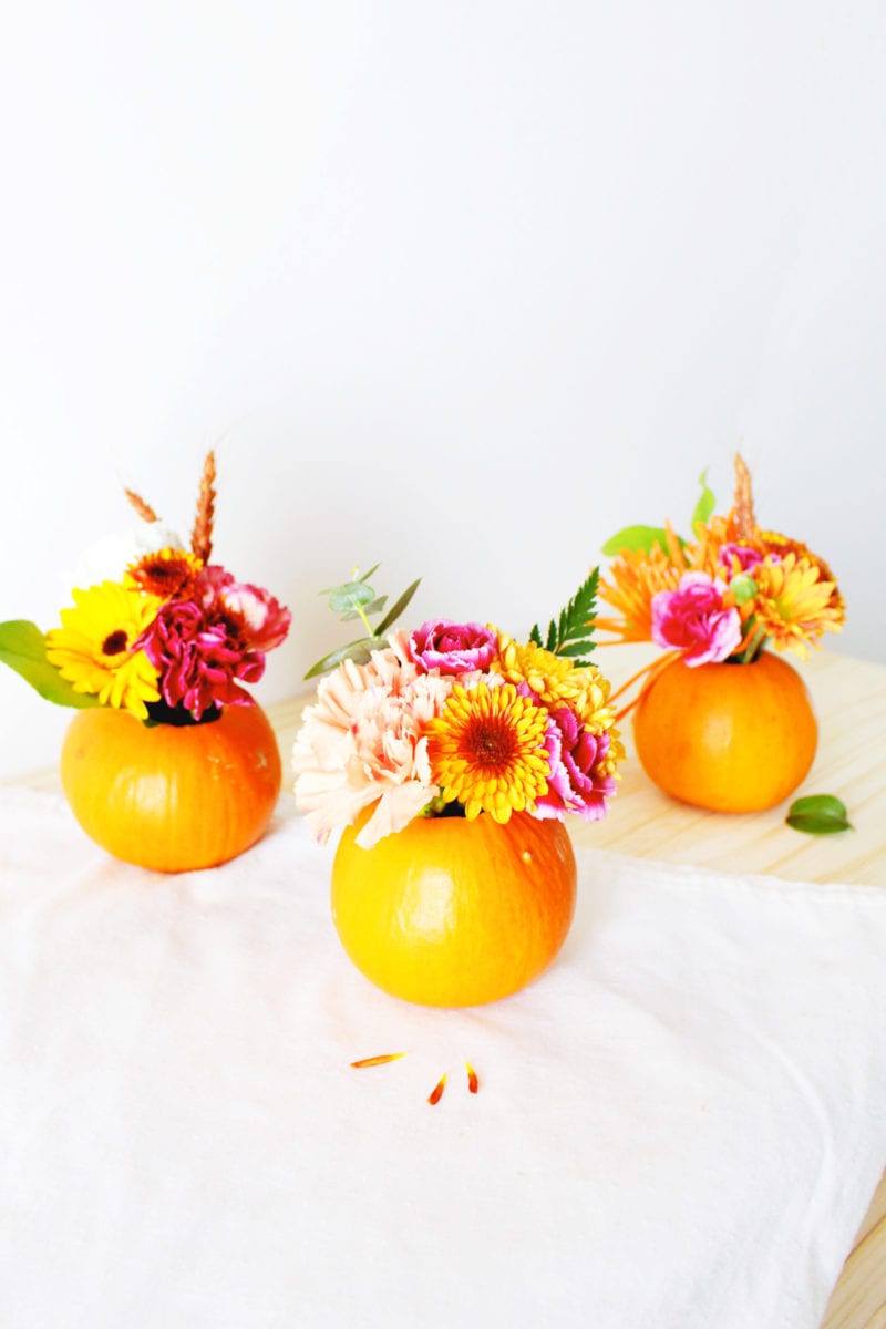 A mini pumpkin floral arrangement is the perfect touch for your Thanksgiving table or fall decor.